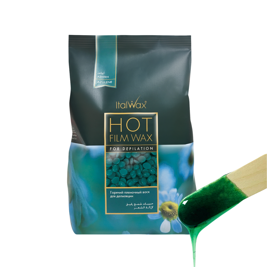 W312 Italwax Azulene Film Wax | A bag of Italwax Azulene Hot Film Wax for depilatory use, shown on a white background with a wooden spatula holding a green wax smear.