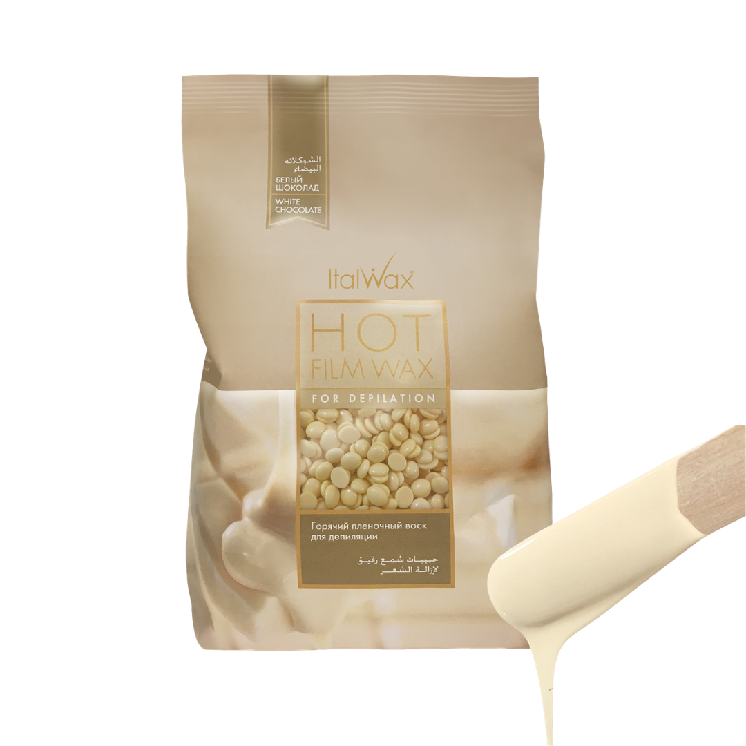 W313 Italwax White Chocolate Film Wax | A beige stand-up pouch of Italwax White Chocolate Hot Film Wax for body depilatory use, shown on a white background with a cream-colored spatula and dripping wax in the lower right corner.