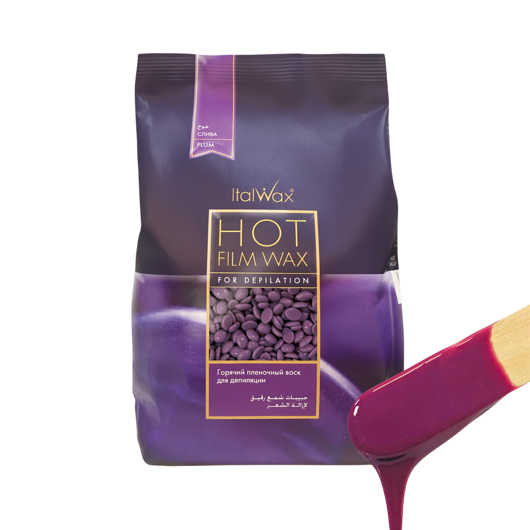 W314 ItalwaxPlum Film Wax |A bag of Italwax Plum Hot Film Wax for depilatory use, shown in a deep purple shade with a wooden spatula dripping the same purple wax on a clean white background.