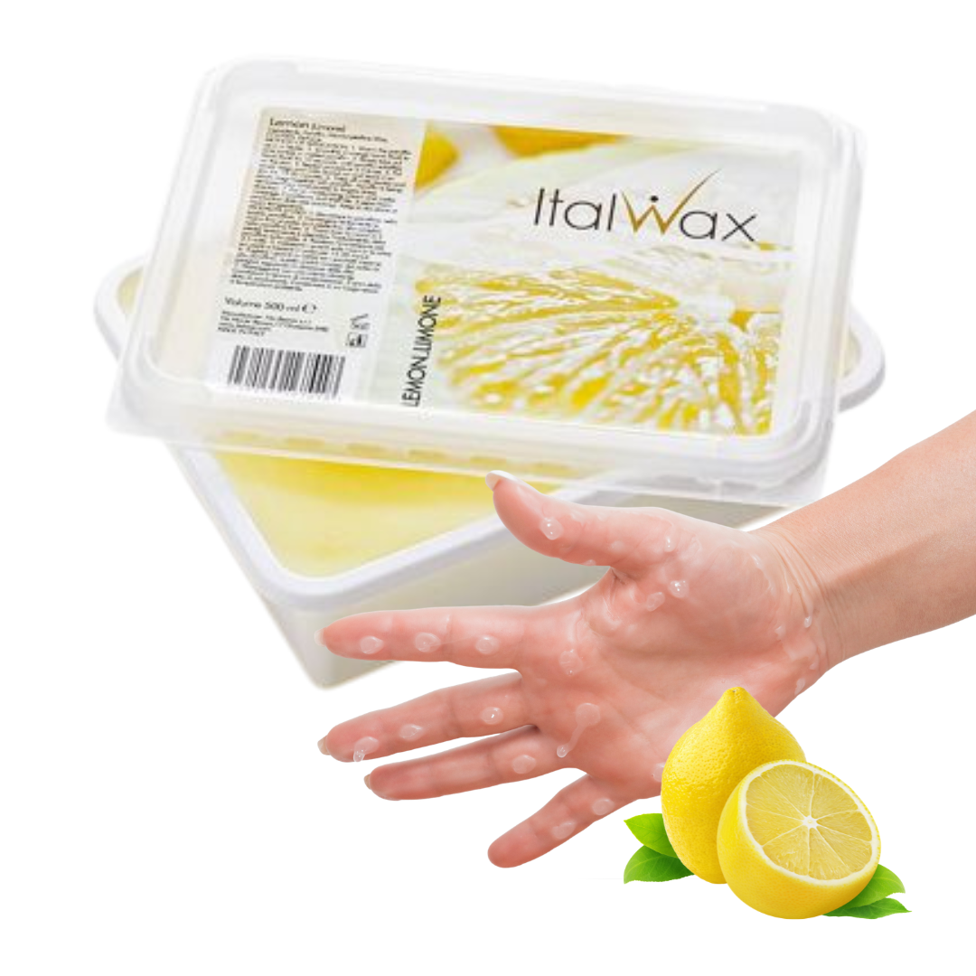 W320 Italwax Lemon Paraffin Wax |A clear plastic tub of Italwax paraffin wax with lemon imagery on the label, shown with a hand reaching toward it and lemon slices with green leaves at the bottom right on a white background.