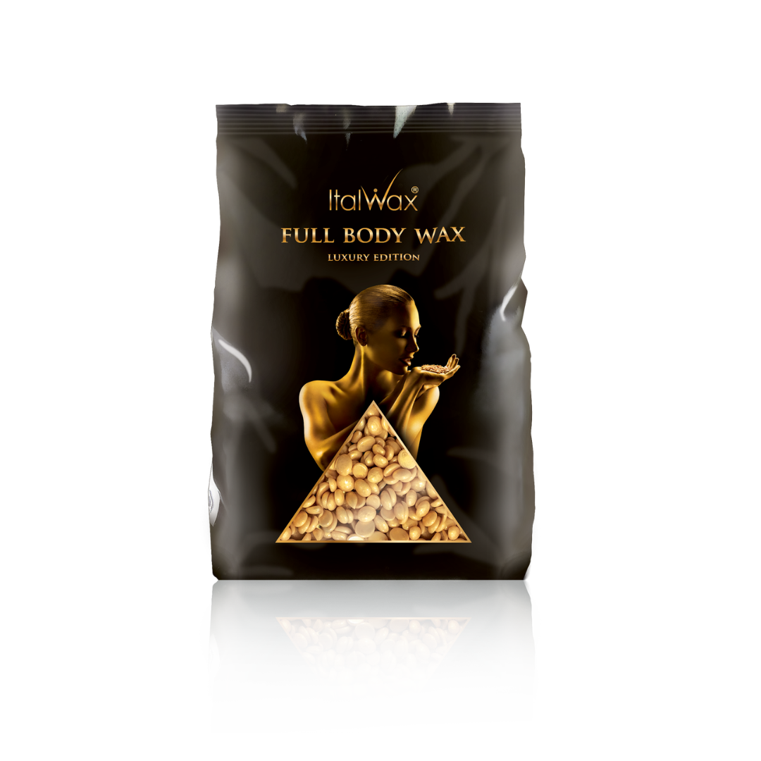 A black stand-up pouch of ItalWax Full Body Wax Luxury Edition, featuring a gold-toned illustration of a woman and a triangular window showing wax beads, on a white background with a soft reflection.