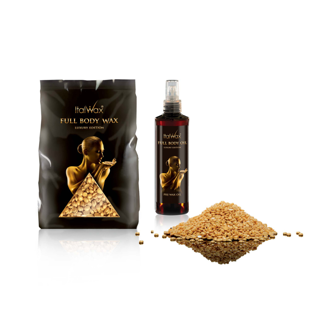 ItalWax Full Body Wax kit featuring a black pouch with film wax, a dark spray bottle containing full doy oil, and a pile of gold wax beads on a white background.