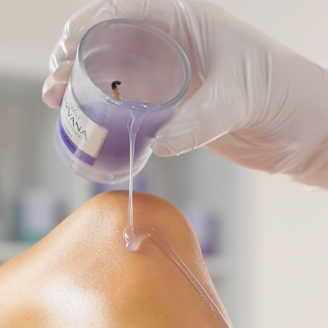 W386 Italwax Vanira Spa Lavender After Wax Massage Candle | Person applying Italwax Vanira Lavender massage post wax liquid from glass candle on to skin