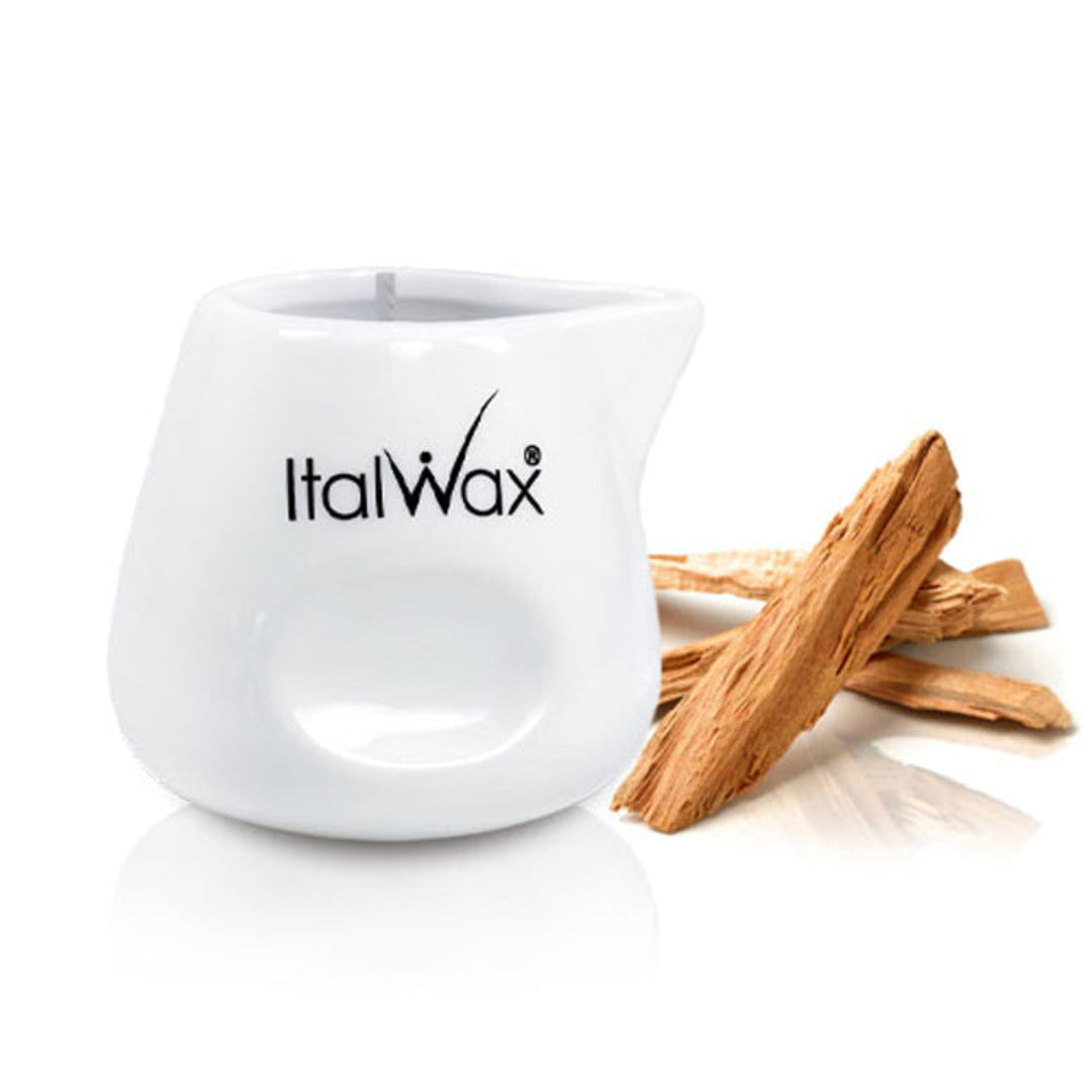 W387 Italwax After wax Massage Candle | An Italwax Sandalwood post waxing massage candle in white ceramic holder with the brand name and sandalwood in the background