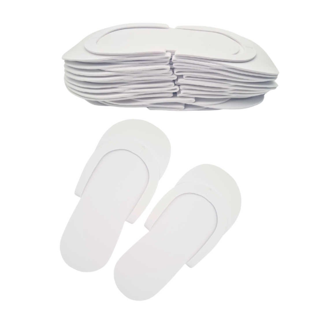 Z701A White Disposable EVA foam slippers | Stack of white disposable EVA foam slippers in the background and another pair in front on a white background
