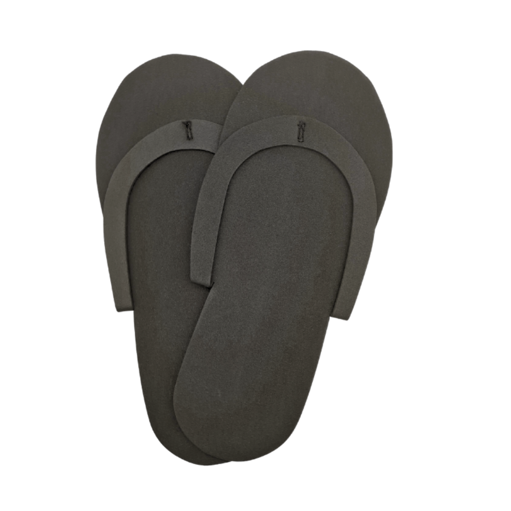 Z701K Black Disposable EVA foam slippers | A pair of black disposable foam slippers on a white background