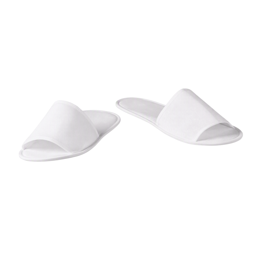 A pair of white open-toe slide slippers shown on a plain white background.