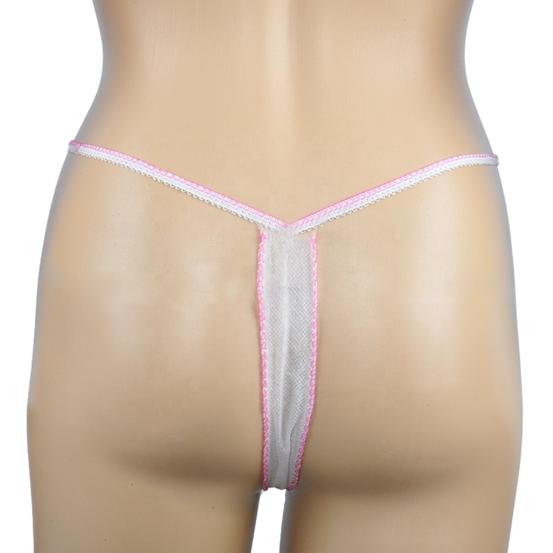 Z702E Disposable Waxing Body wrap G-string |A close-up rear view of a disposable non-woven thong-style underwear piece displayed on a beige mannequin torso against a plain white background.