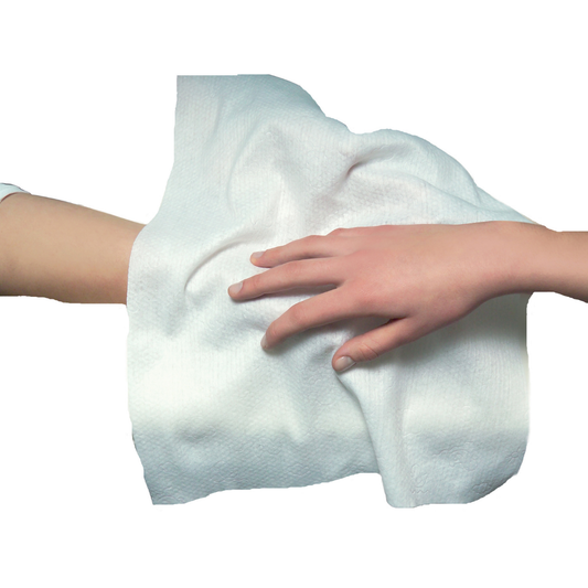 A white textured disposable towel being held and pressed by a person's hand against a plain white background.