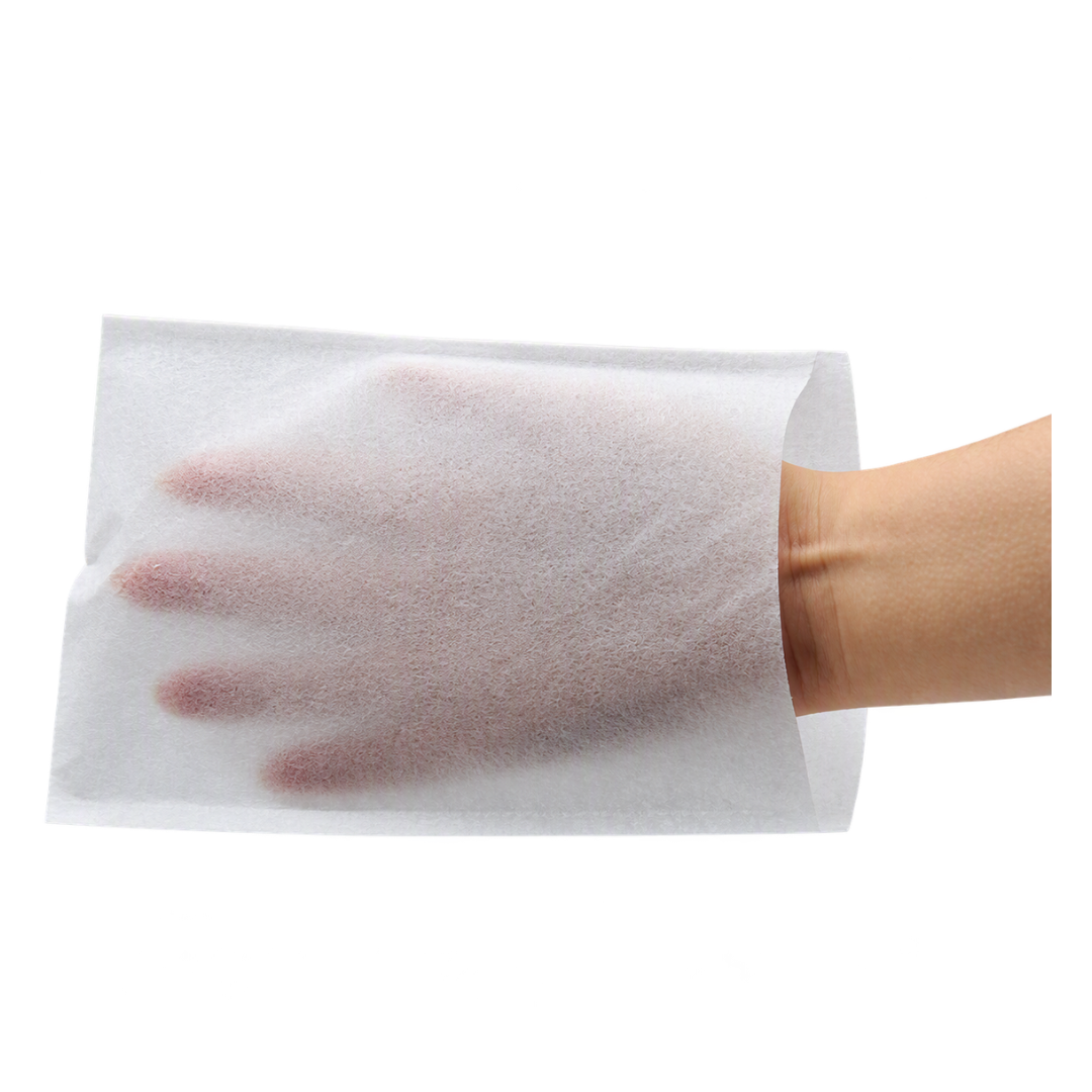 A white woven face wash mitten with a hand inside on a white background