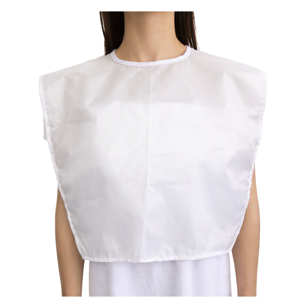 A white waterproof makeup bib worn by a model, shown from the neck down against a plain white background.