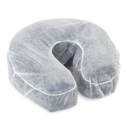 Z736 Fitted Massage Bed Breathing Hole Cushion Cover 100pack | A U-shaped massage bed cushion covered in a translucent white protective disposable non-woven liner, shown against a plain white background.