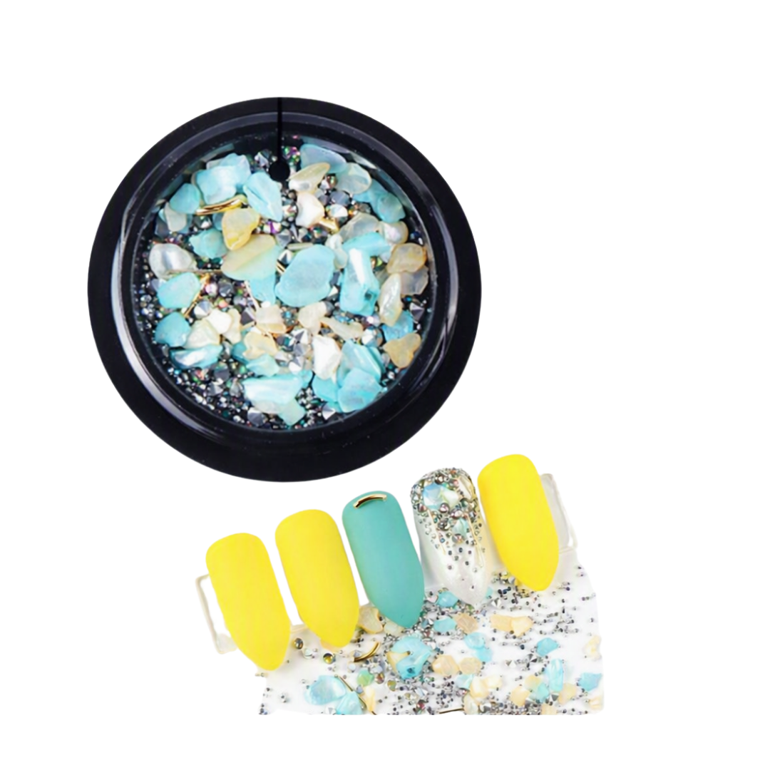 Light Blue and yellow micro zirconium shell stones for nail art in black round container with examples of nail art in foreground 