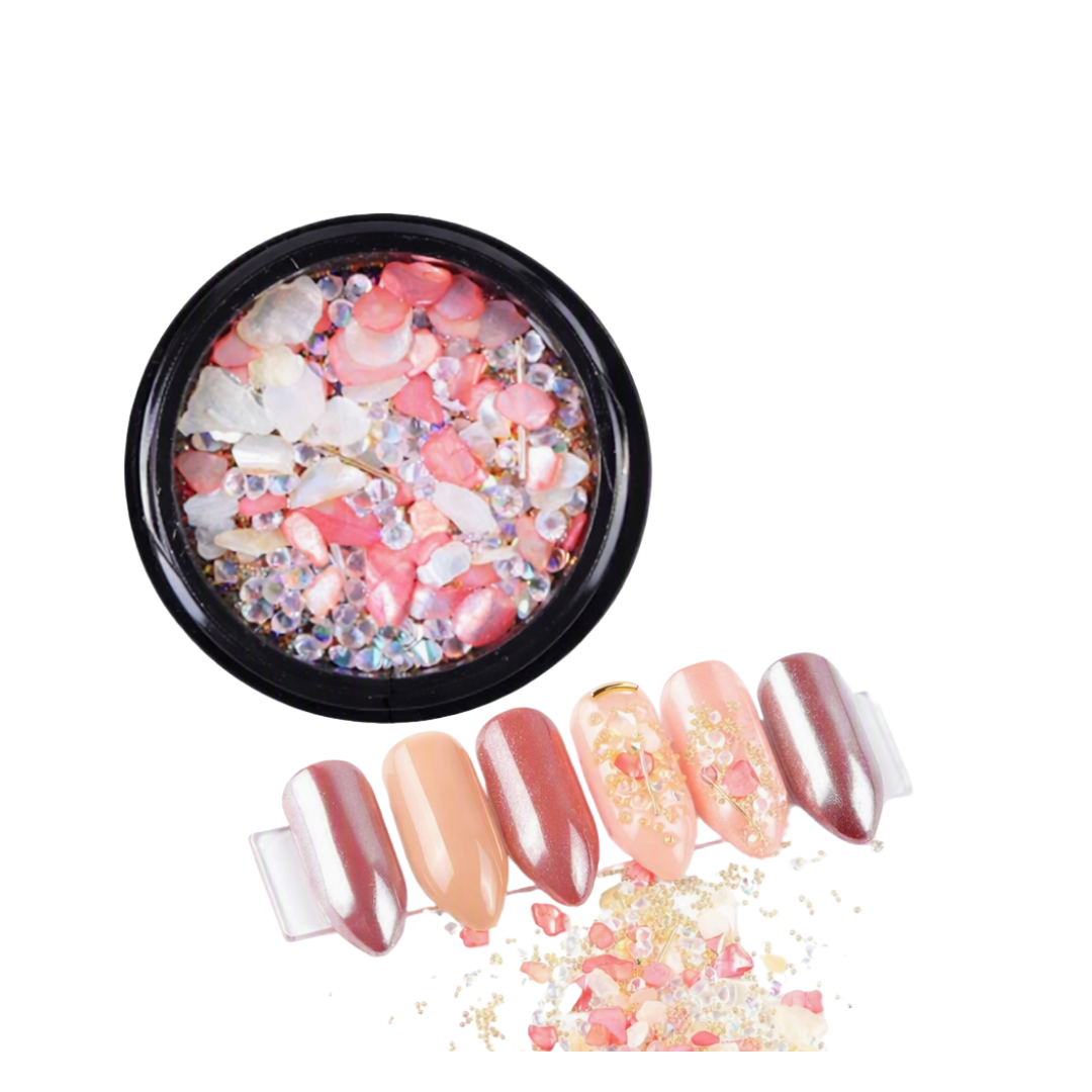 Shades of Peach and Clear micro zirconium shell stones for nail art in black round container with examples of nail art in foreground 