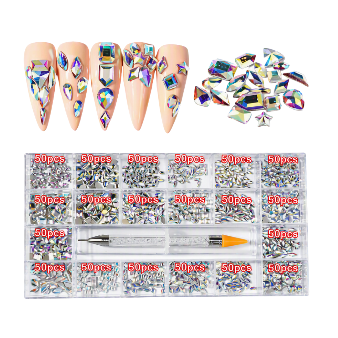 Nail art rhinestone set shown with four example long nude nails decorated with iridescent faceted gems, a pile of loose gems, and a clear storage tray containing many compartments labeled 50pcs with a dual-ended tool.