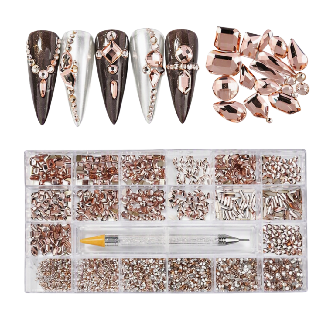 Nail art rhinestone kit with a clear organizer tray filled with rose gold, silver, and clear gems, plus a small dual-ended tool and a pile of faceted rose gold gems shown above four decorated nail sample tips on a white background.