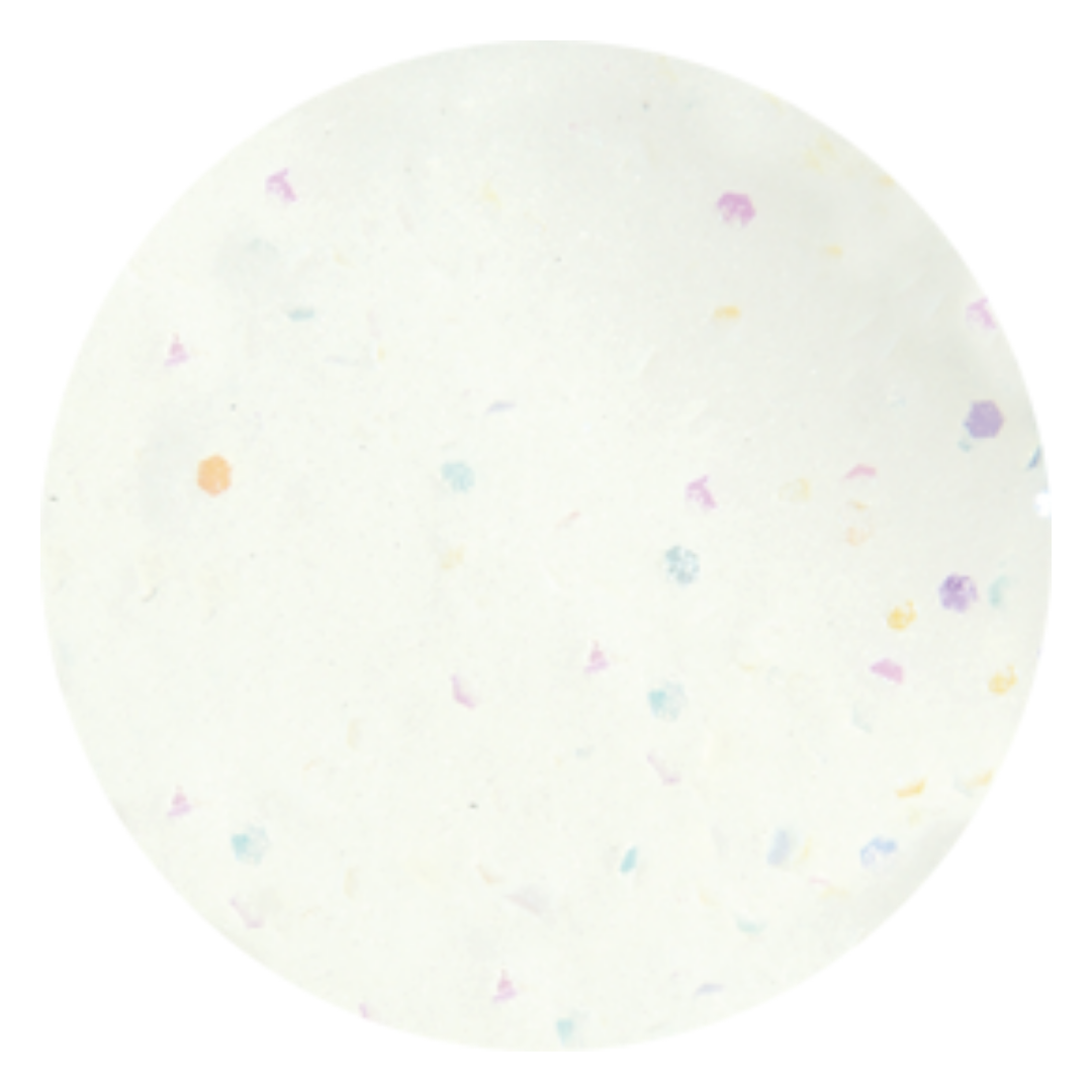 A circular Supernail acrylic powder white swatch with a subtle speckled pattern of tiny pastel confetti dots in purple, blue, yellow, and orange, isolated on a white background.