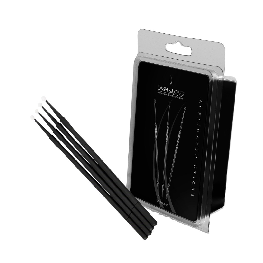 Eyelash applicator sticks with black handle and white fine tips on a white background