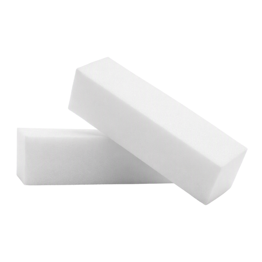 Two white rectangular nail sanding buffer blocks, one lying flat and one standing at an angle on top, shown on a plain white background.