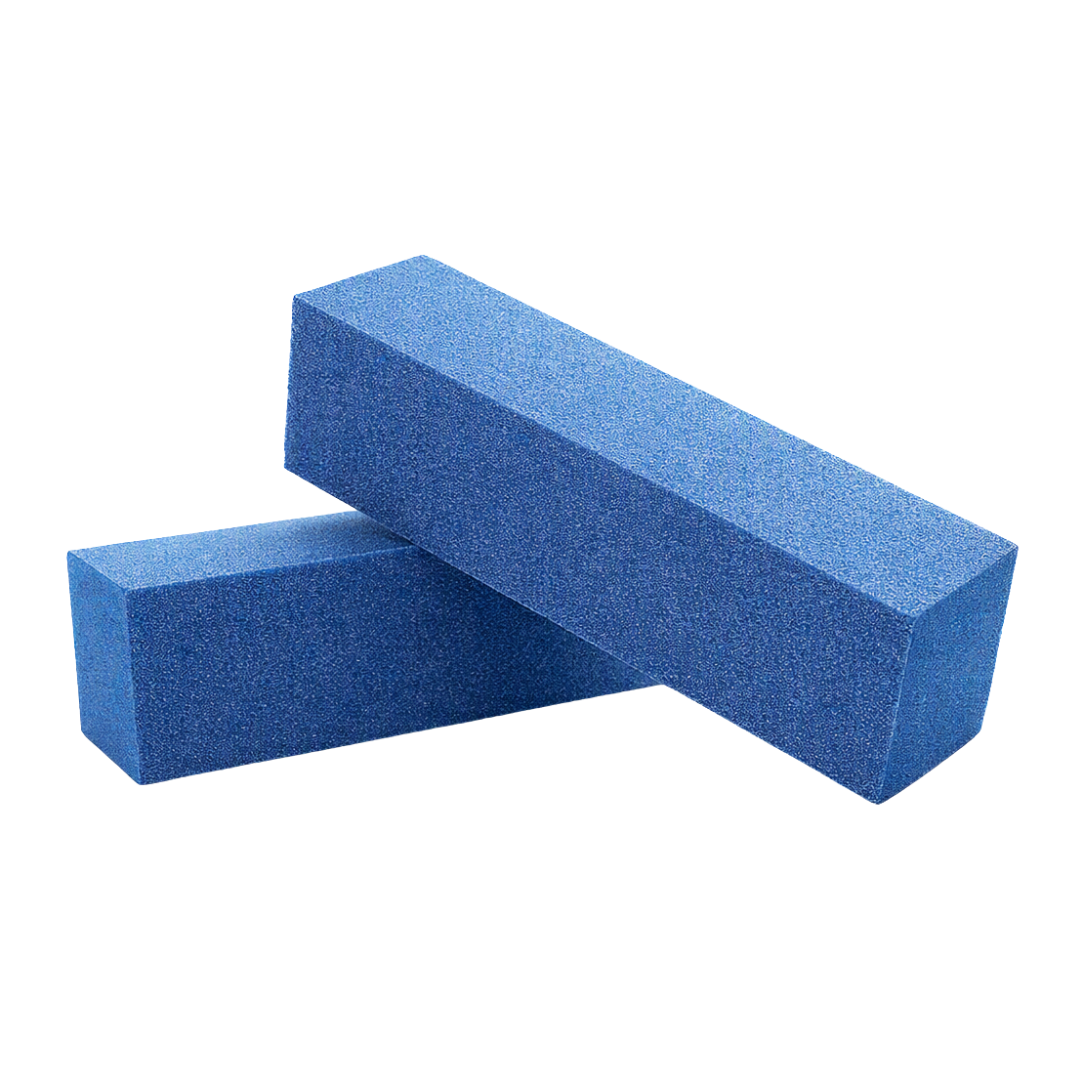 Two blue rectangular foam nail buffing blocks with a textured, porous surface, stacked diagonally on a plain white background.