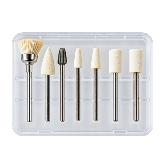A 6-piece nail drill bit set in a clear plastic case, featuring a small brush with beige bristles, three tapered conical bits, and two cylindrical bits, all with silver metal shanks.