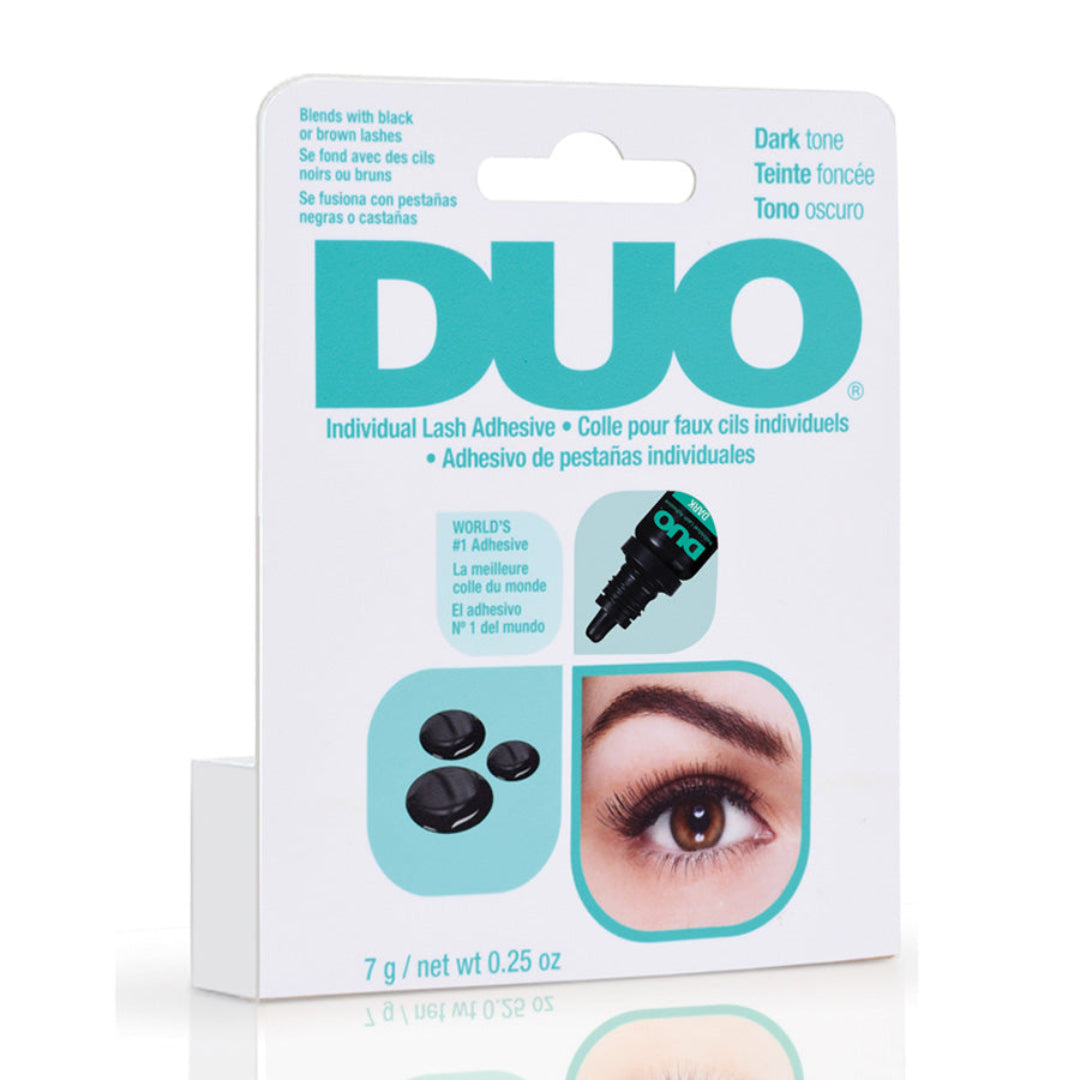 Duo Dark Lash Adhesive in white packaging with teal branding, showing dropper bottle and black adhesive on a white background