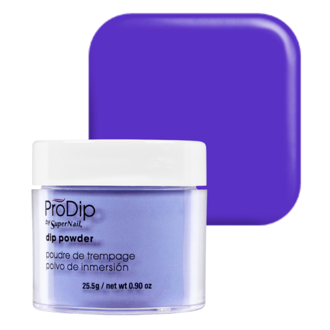 A jar of ProDip by SuperNail acrylic dipping powder in a vibrant purple shade, shown in front of a matching solid purple color swatch on a white background.