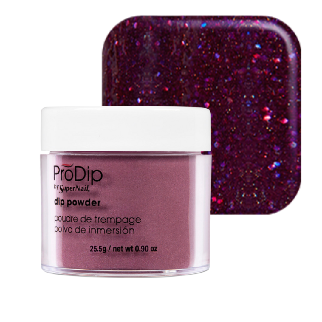 ProDip SuperNail acrylic dipping powder jar in a deep purple glitter shade, shown in front of a square swatch of the same sparkling purple powder on a white background.