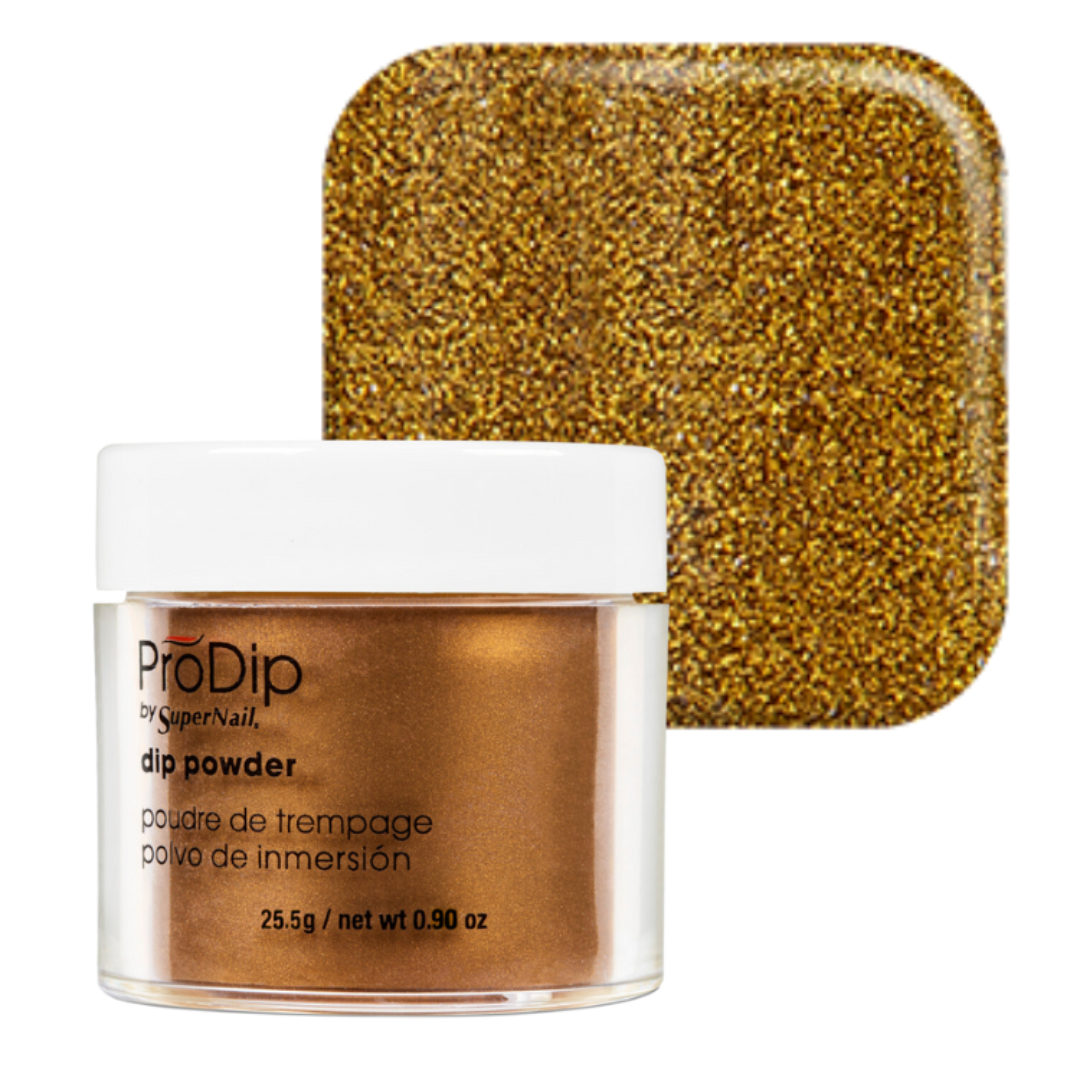 A jar of ProDip acrylic dipping powder with a white lid and clear container showing metallic bronze powder, alongside a square swatch of the glittery gold-bronze powder texture on a white background.