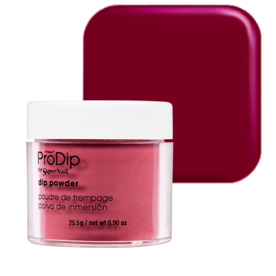 A jar of ProDip by SuperNail acrylic dipping powder in a deep berry pink shade, shown in front of a matching square color swatch on a white background.