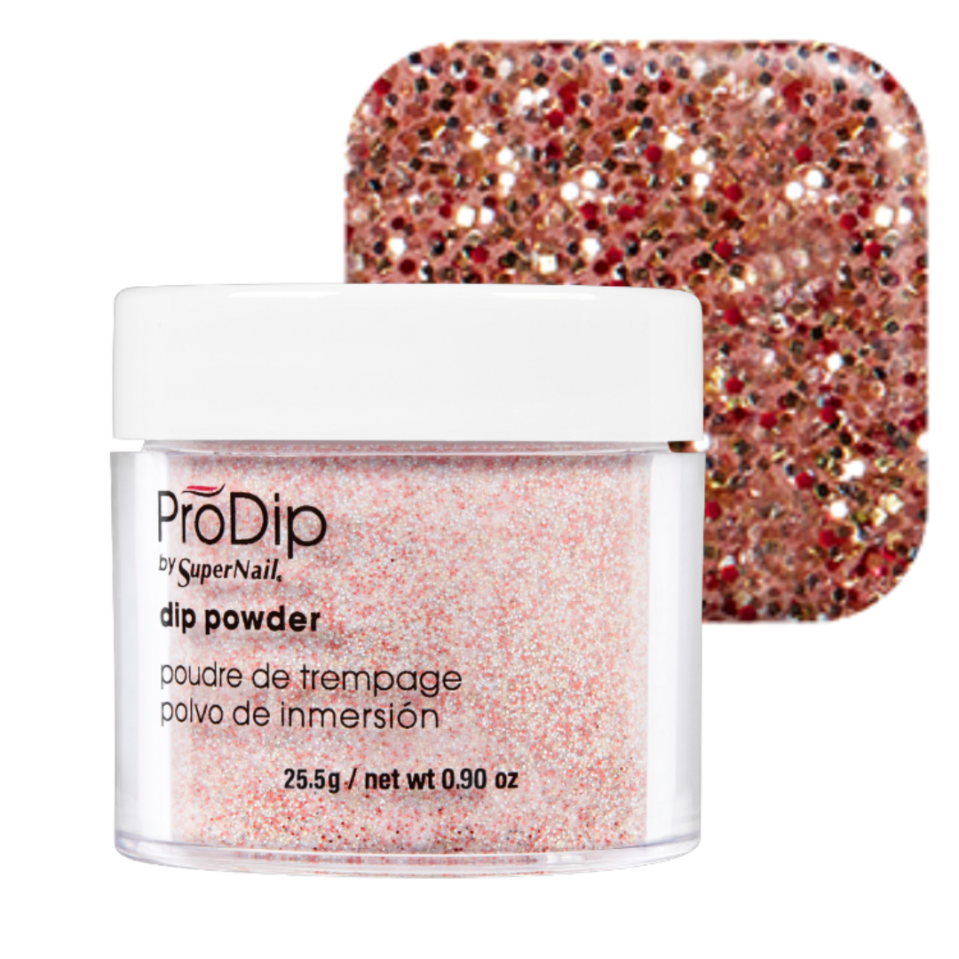 A jar of ProDip by SuperNail glitter acrylic dipping powder in front of a square swatch showing the pink glittery finish, on a white background.