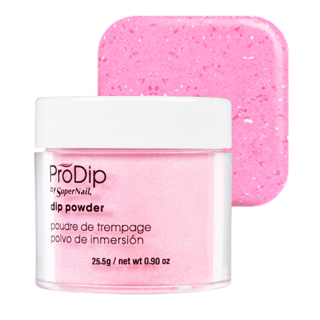A jar of ProDip SuperNail acrylic dipping powder in a sparkling light pink shade, shown in front of a matching square swatch of the pink glitter powder on a white background.