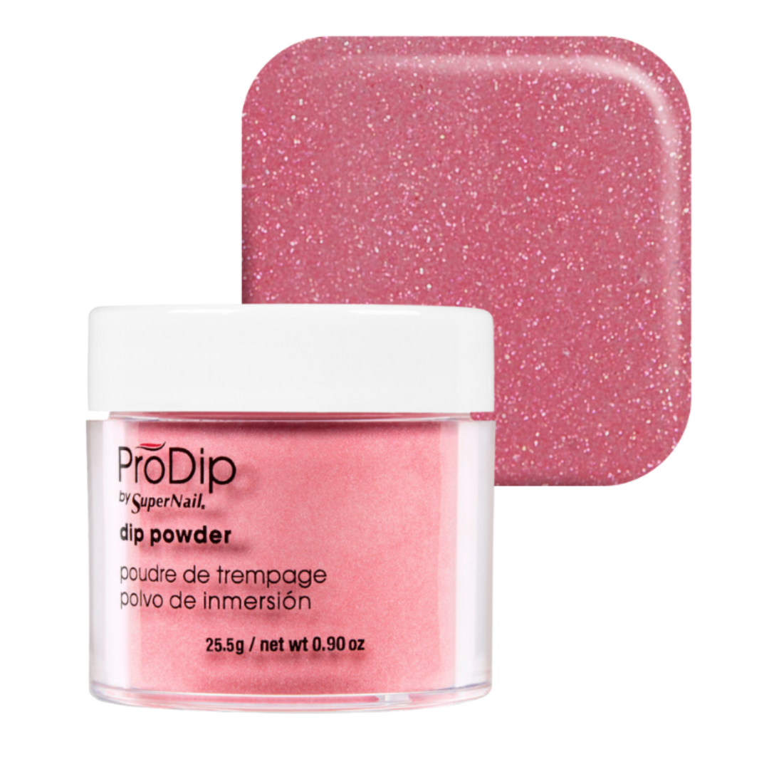 A jar of ProDip SuperNail acrylic dipping powder in a sparkling pink shade, shown in front of a matching square swatch of the glittery pink powder on a white background.