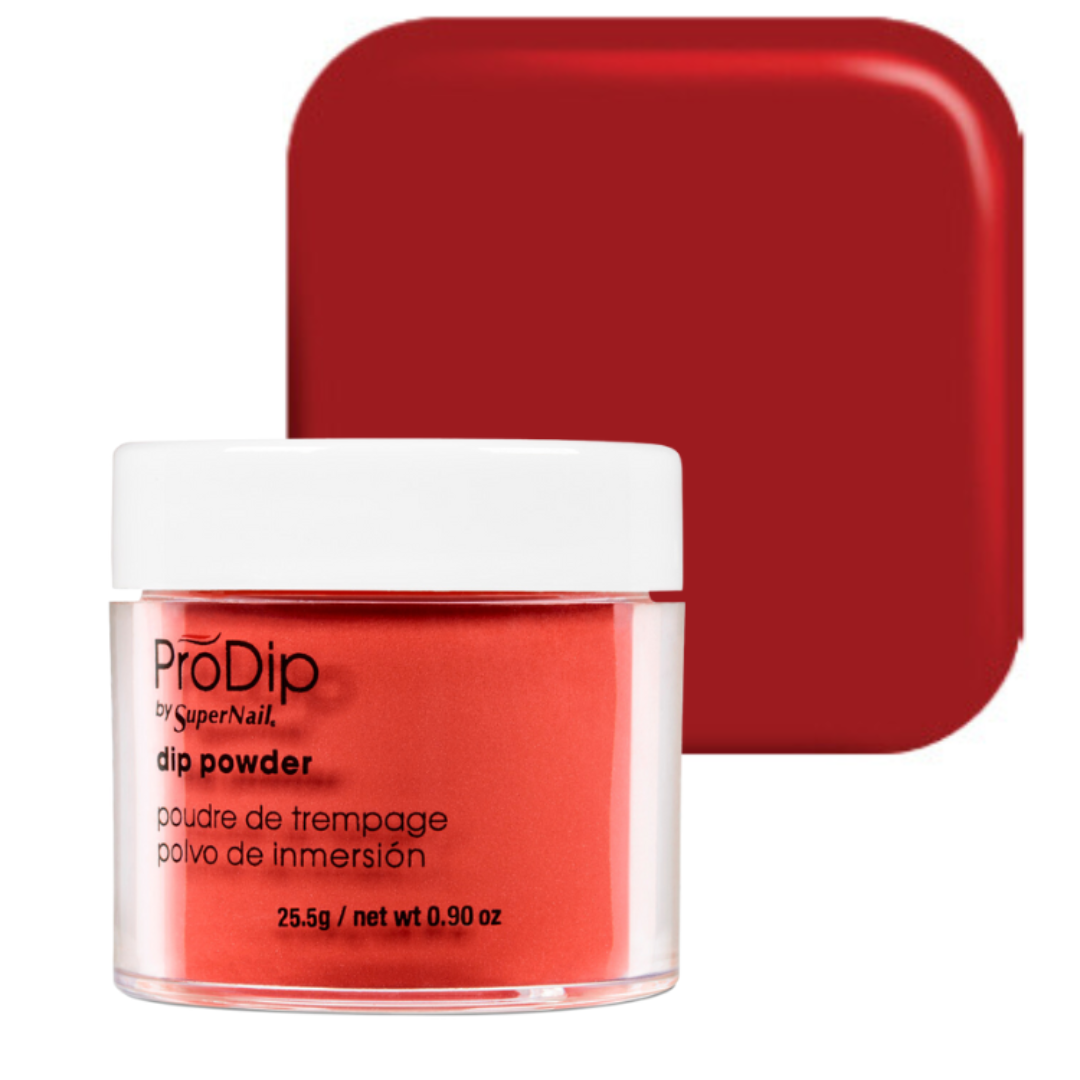 A jar of ProDip by SuperNail acrylic dipping powder in a vibrant red shade, shown in front of its matching red square packaging box on a clean white background.