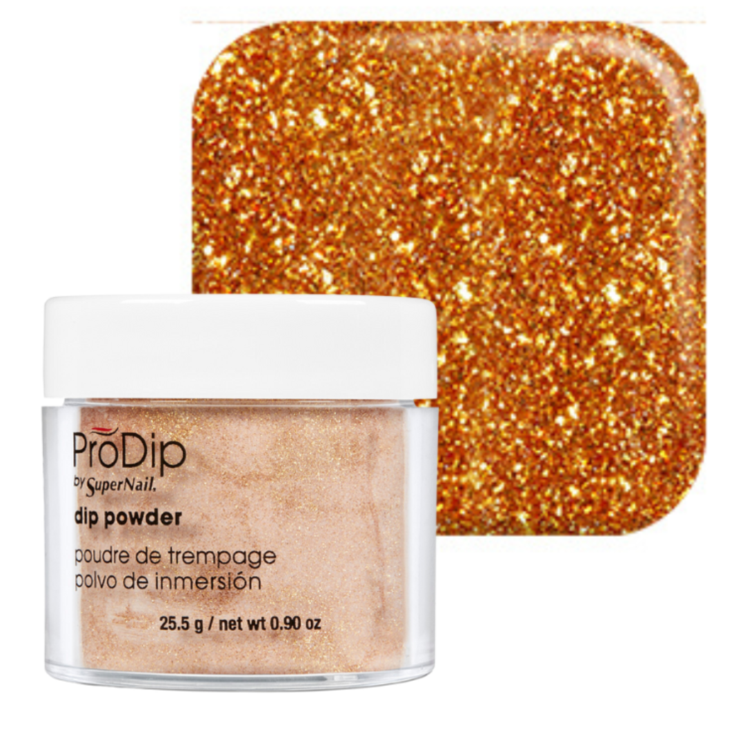 A jar of ProDip SuperNail acrylic dipping powder with a white lid and clear container, shown in front of a square swatch of the glittery gold-orange powder.