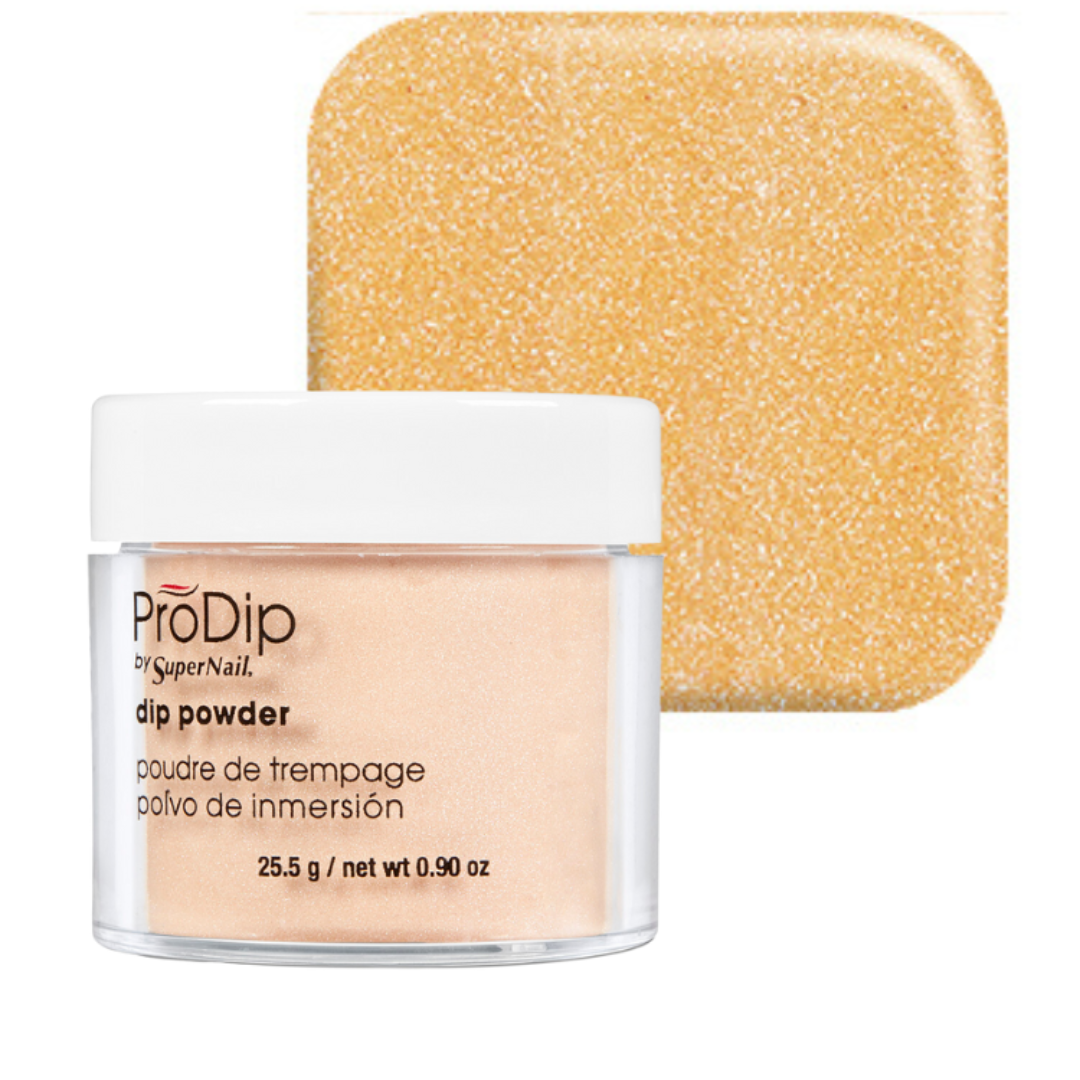 ProDip by SuperNail acrylic dipping powder in a clear jar with a white lid, shown in front of a square swatch of the shimmering gold-beige powder.