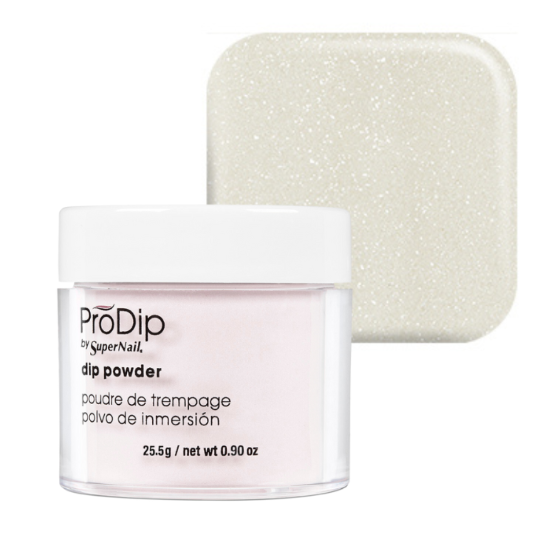 A jar of ProDip by SuperNail acrylic dipping powder with a white lid and clear container showing a pale pink powder, alongside a square swatch of the same glittery off-white powder on a white background.