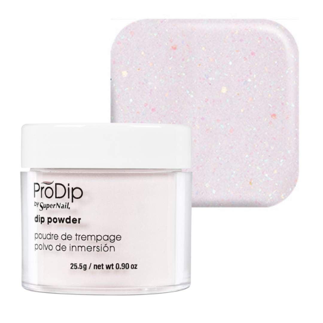 A jar of ProDip by SuperNail acrylic dipping powder with a white lid and clear container, shown in front of a square swatch displaying the light pink glittery powder color.