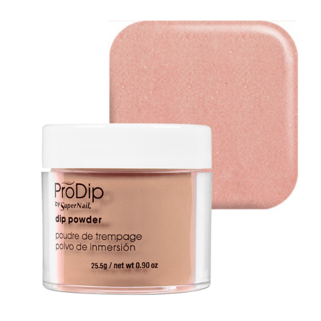 ProDip by SuperNail acrylic dipping powder in a clear jar with a white lid, shown in front of a square swatch of the dusty pink nail polish color on a white background.