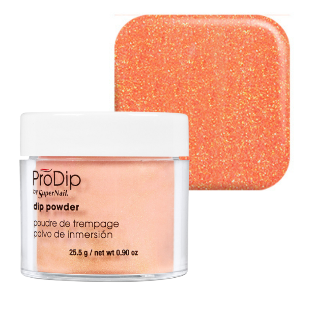 ProDip nail acrylic dipping powder in a clear jar with a white lid, shown in front of a square color swatch displaying the glittery orange-peach powder color.