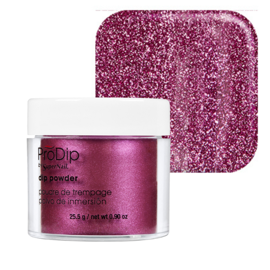 ProDip SuperNail acrylic dipping powder in a metallic magenta shade, shown in a clear jar with a white lid next to a square color swatch of the glittery powder.