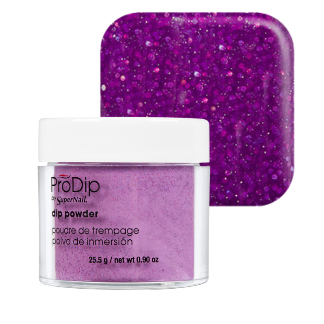 A jar of ProDip glitter acrylic dipping powder in a vibrant purple shade, shown in front of a matching square swatch of the glitter powder on a white background.