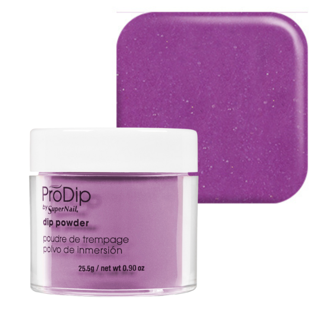 A jar of ProDip by SuperNail dip powder in a sparkling purple shade, shown in front of a matching square color swatch on a white background.