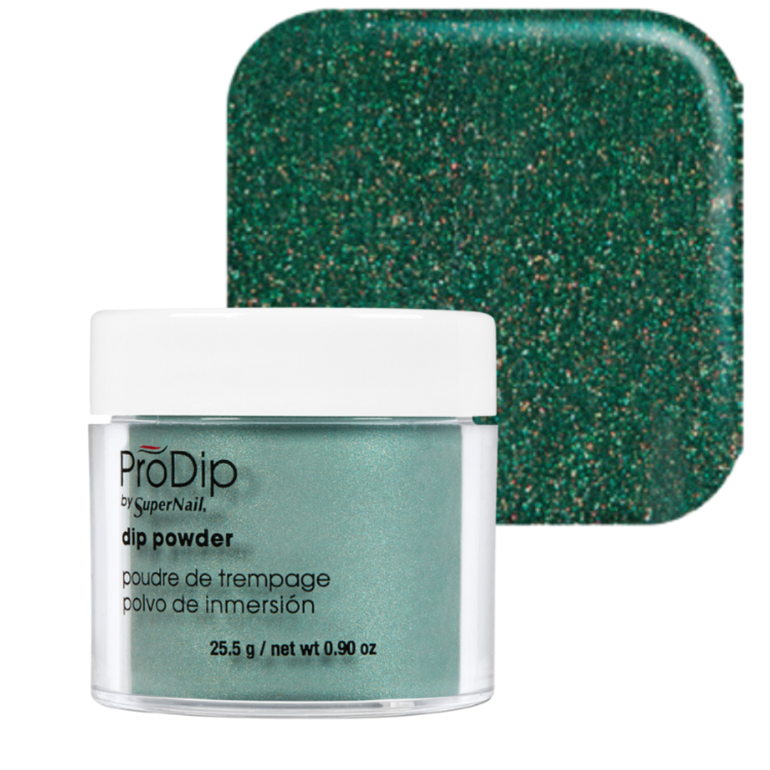A jar of ProDip SuperNail acrylic dipping powder with a white lid and clear container, shown in front of a square swatch of the same sparkling green glitter powder on a white background.