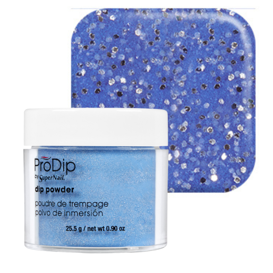 A jar of ProDip SuperNail acrylic dipping powder in a light blue shade with silver glitter, shown in front of a square swatch displaying the same blue glitter texture on a white background.