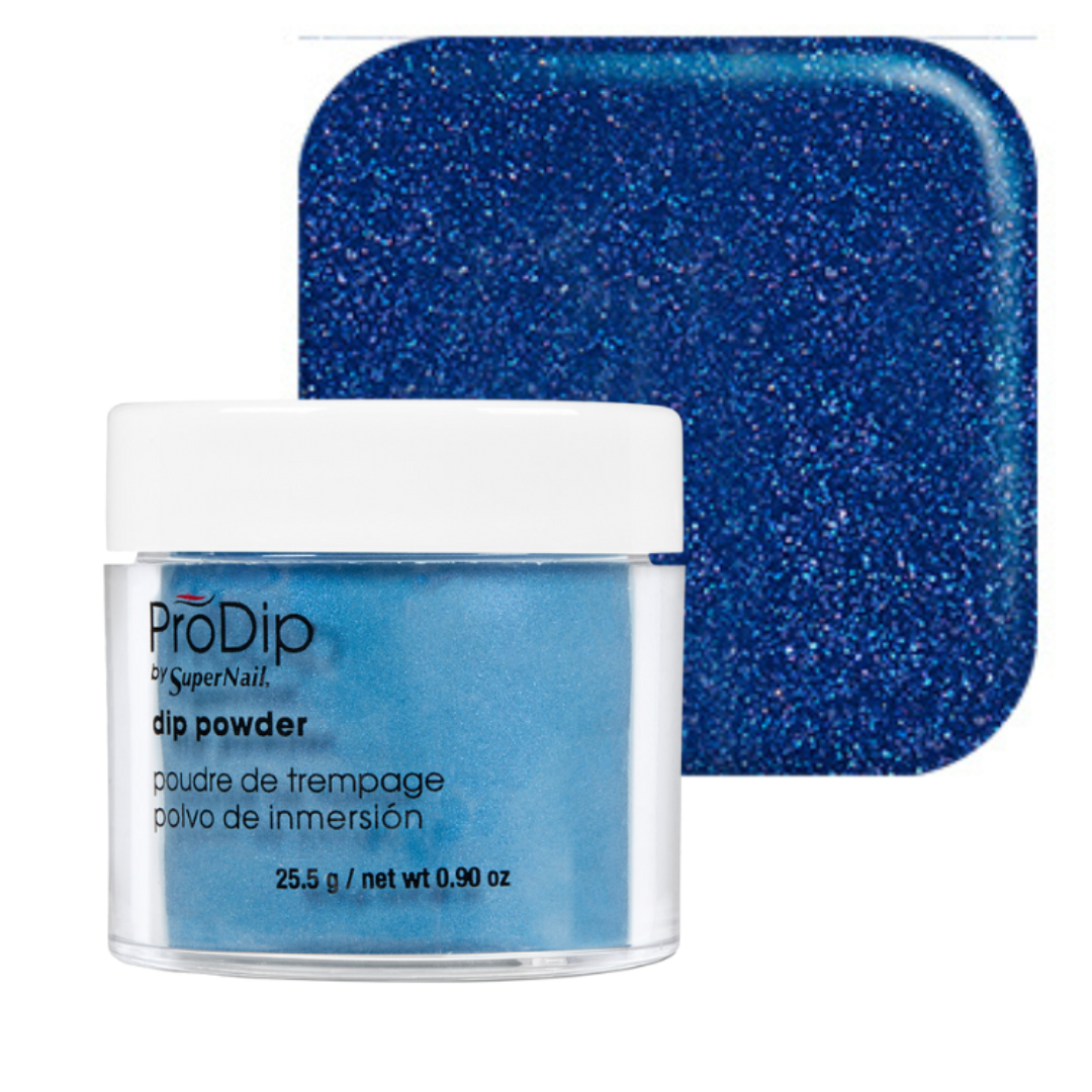 ProDip by SuperNail acrylic dipping powder in a clear jar with a white lid, shown in front of a square blue glitter swatch on a white background.