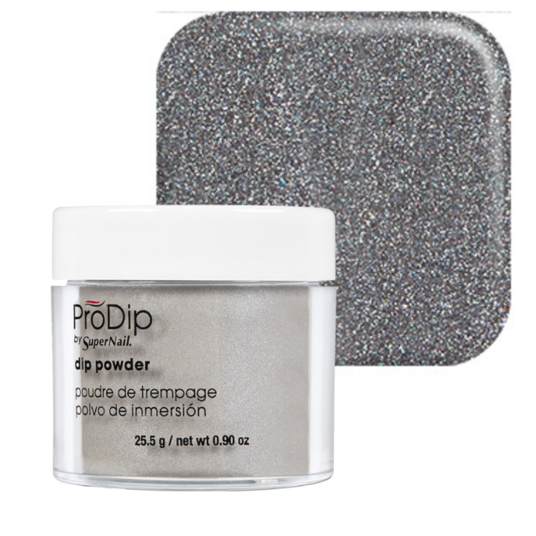 ProDip by SuperNail acrylic dipping powder in a clear jar with a white lid, shown in front of a square swatch displaying the sparkly silver-gray powder texture.