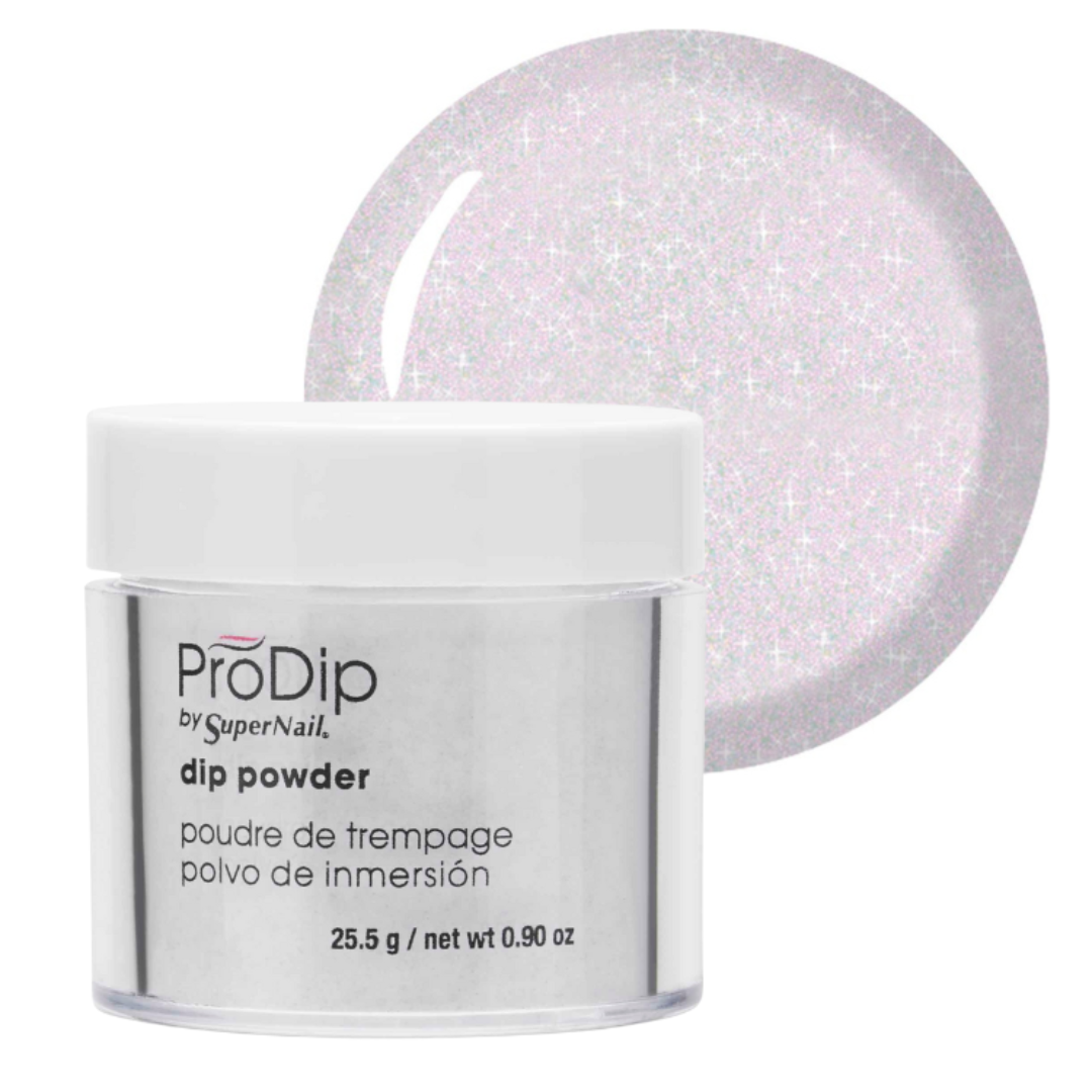 A jar of ProDip by SuperNail acrylic dipping powder with a white lid and clear container, shown in front of a circular swatch displaying the light pink glittery powder color.