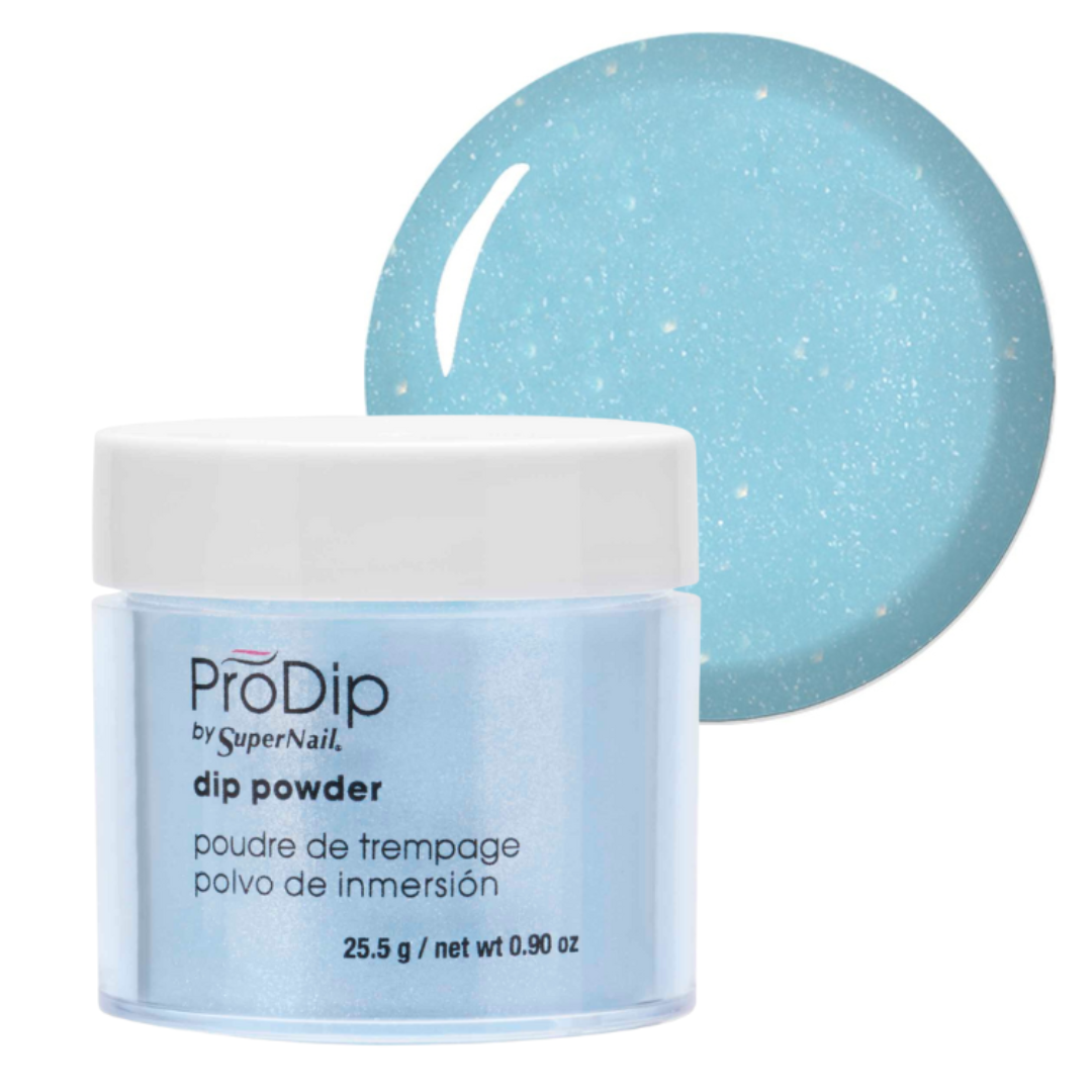 ProDip by SuperNail acrylic dipping powder in a light blue glitter shade, shown in a clear jar with a white lid alongside a circular swatch of the same light blue glitter powder on a white background.