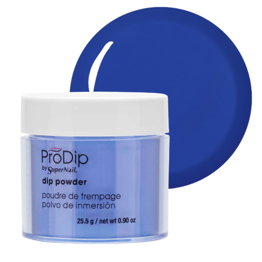 A jar of ProDip by SuperNail acrylic dipping powder in a vibrant blue shade, shown with a matching blue circular color swatch behind it on a white background.